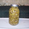 A jar of green beans preserved by canning.