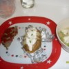Potato stuffed with cheese, jalapeno, and toppinds, served on plate