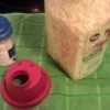 Use a lid as a thrifty funnel.