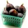 Green plastic basket of fresh figs.