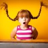 Young girl with red braids sticking straight up