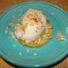 Grilled pineapple topped with coconut sorbet and toasted coconut.