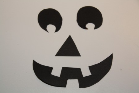 Cut Out Black Paper in Jack-O-Lantern Face