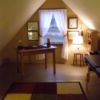 Room with a steeply pitched ceiling.