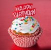 A birthday cupcake with a topper.
