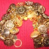 Gold button bracelet.