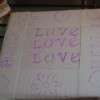 Tile with stenciled duct tape ready for painting.