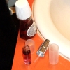 Small open perfume bottle on sink counter.