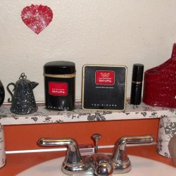 A makeshift shelf for the bathroom counter, covered in contact paper.