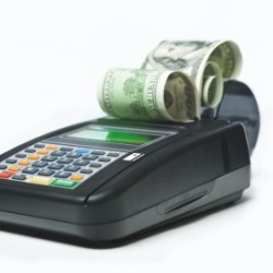 Credit card machine spitting out cash.