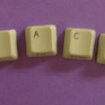 Photo of magnets made with keyboard keys.