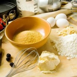 Baking ingredients on a wood bread board.
