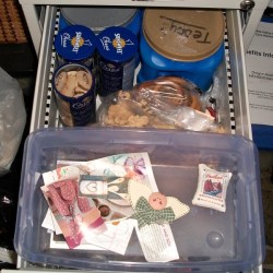 Plastic shoebox in file cabinet drawer.