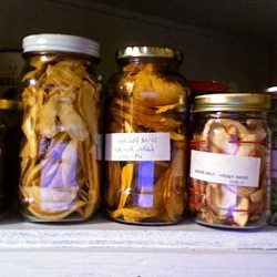 Jars of dried food on a shelf.
