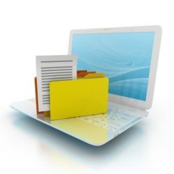 A laptop computer with file folders on the keyboard.