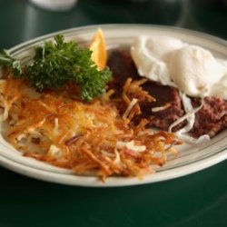 Photo of eggs, toast and hash browns.