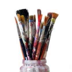 Paint laden art brushes in a jar.