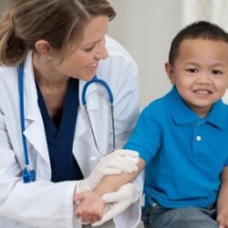 A child being seen by a doctor.