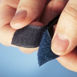 Woman Separating a Velcro Strip