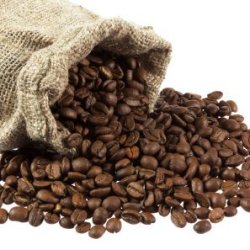 Whole coffee beans spilling from a bag.