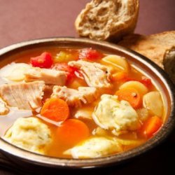 Turkey dumpling soup with carrots.