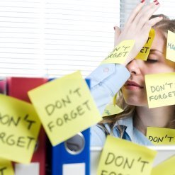 A women covered in post-it notes.