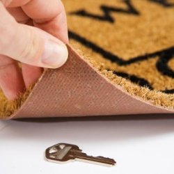 Hiding Keys, A key hidden under a mat.