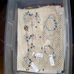 Shelf liner in the bottom of a plastic container.