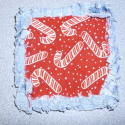 Potholder square red and white candy cane fabric with frayed edges
