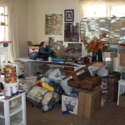Stacks of craft items and boxes all over the place (before)