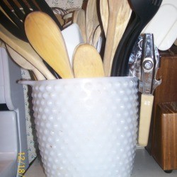 Milk glass jar utensil holder.