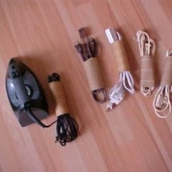 Storing appliance cords in toilet paper tubes to keep from tangling.
