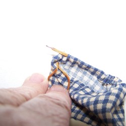Threading A Drawstring using a needle.