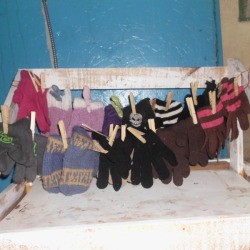 Hang Mittens In Pairs, on string or twine.