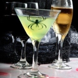 A glowing drink with a spider inside it.