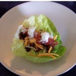 Taco filling on lettuce leaf.