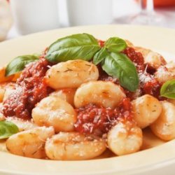 Gnocchi on Plate With Basil and Tomato