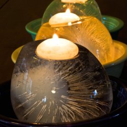 Melting Ice Candles in Bowls in a Row