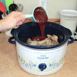 Pouring BBQ Sauce into crockpot