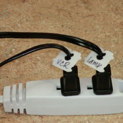 Bread ties marking cords on a power strip.