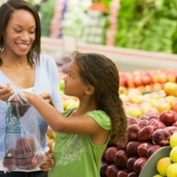 Mother and Daughter Shopping at Supermarket