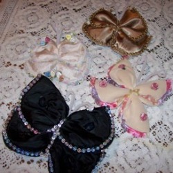 Soft sculpture butterflies made from shoulder pads. 