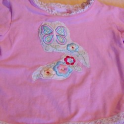 Shirt made by coming two stained shirts.