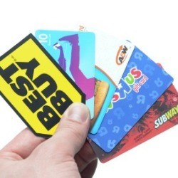 Hand with Many Gift Cards Fanned Out