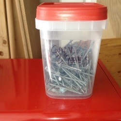 Organizing nails in recycled plastic containers.