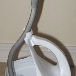 Toilet brush holder made with a milk jug.