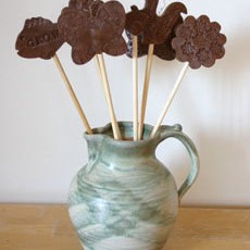 Garden stakes in ceramic jar.