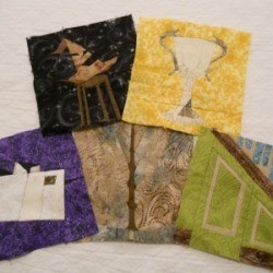 Five paper pieced quilt blocks.