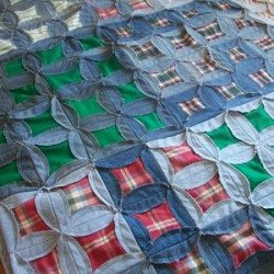 Denim and plaid flannel quilt.