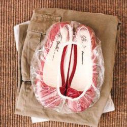 Red shoes inside shower cap.